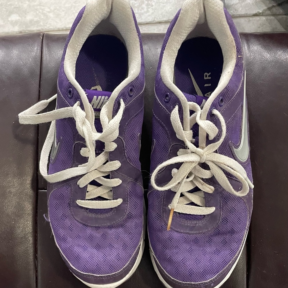 Purple Nike air tennis shoes.